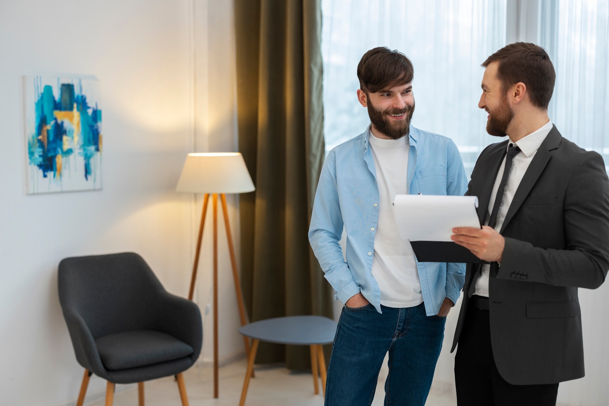 male real estate agent doing business showing house potential buying couple 23 2150164713
